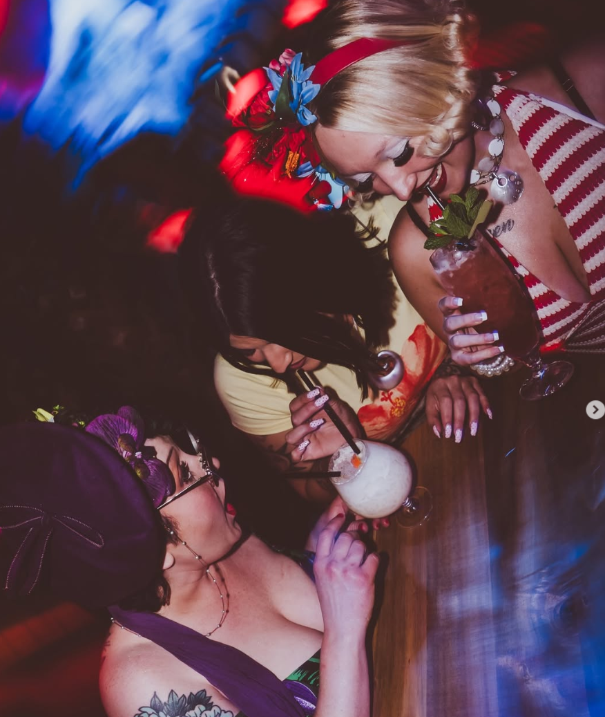 Guests enjoying tiki drinks